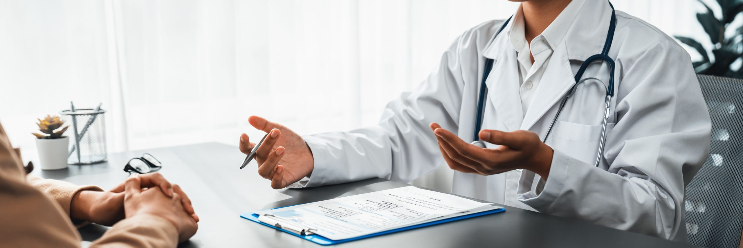 Doctor show medical diagnosis report to young couple. Neoteric